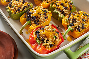 Mexican stuffed peppers in a baking dish on the table