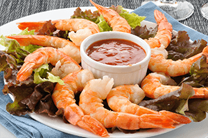 Shrimp cocktail on a plate with cocktail sauce