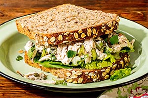 a leftover Thanksgiving turkey salad sandwich on a plate